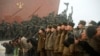 North Korean soldiers salute as others bow to bronze statues (not pictured) of North Korea's late founder Kim Il-sung and late leader Kim Jong Il at Mansudae in Pyongyang, in this photo provided by Kyodo, February 16, 2015.