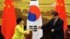 FILE - South Korean President Park Geun-hye, left, and Chinese President Xi Jinping, Great Hall of the People, Beijing, June 27, 2013.