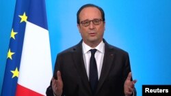 French President Francois Hollande, seen in this picture taken from French TV, makes a televised address from the Elysee Palace in Paris, Dec. 1, 2016. 