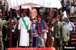 Liberia's former President Ellen Johnson Sirleaf and the new President-elect George Weah are seen during his swearing-in ceremony at Samuel Kanyon Doe Sports Complex in Monrovia, Liberia, Jan. 22, 2018.