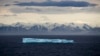 FILE - An iceberg floats past Bylot Island in the Canadian Arctic Archipelago, July 24, 2017.