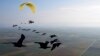This photo provide by Waldrappteam Conservation & Research shows the migration from Northern Bald Ibis, or the Waldrapp, supported by foster parents of the birds in a microlight aircraft, in September 2022.
