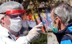 A man is tested for a coronavirus outside a hospital in Sarajevo, Bosnia and Herzegovina, 02 April 2020.