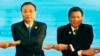 FILE - In this Sept. 7, 2016, photo, Chinese Premier Li Keqiang (L) and Philippine President Rodrigo Duterte link arms during the ASEAN Plus Three summit in Vientiane, Laos. After lashing out at longtime ally America, Duterte is making a state visit to Ch