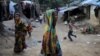 Rohingya Hindu refugees walk through the Kutupalong Hindu refugee camp near Cox's Bazar, Bangladesh, Dec. 17, 2017.