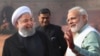 Indian Prime Minister Narendra Modi, right, talks to Iranian President Hassan Rouhani, left, during a ceremonial reception at the Indian presidential palace in New Delhi, India, Feb. 17, 2018.