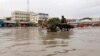 A donkey pulls a cart as they wade through a flooded street in Hamerweyne district of Mogadishu, Somalia, May 20, 2018. 