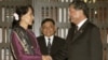 Burma's opposition leader Aung San Suu Kyi, left, shakes hands with Thai Deputy Prime Minister Chalerm Yubumrung during their meeting at Government House in Bangkok, Thailand, May 31, 2012. 