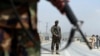 Afghan National Army soldiers stand guard at a checkpoint on the Jalalabad-Kabul road, on the outskirts of Kabul, April 28, 2019.
