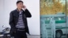 FILE - A North Korean man uses a mobile phone at the Sunan International Airport in Pyongyang, Oct. 27, 2014.