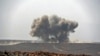 FILE - Smoke billows during clashes between forces loyal to Yemen's Saudi-backed government and Houthi rebel fighters in Yemen's northeastern province of Marib, March 5, 2021. 