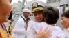In this photo taken Dec. 3, 2010, U.S. navy officer Michael "Vannak Khem" Misiewicz becomes emotional as he embraces his aunt Samrith Sokha, 72, at Cambodian coastal international see port of Sihanoukville, Cambodia. 