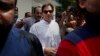 Pakistani politician Imran Khan, chief of Pakistan Tehreek-e-Insaf party, arrives to cast his vote at a polling station for the parliamentary elections in Islamabad, Pakistan, July 25, 2018.