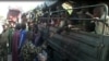 FILE - Nigerian refugees are seen on a Cameroonian military truck set to make its way out of Fotokol for Nigeria, in Fotokol, Cameroon, April 19, 2017. (M.E. Kindzeka/VOA)