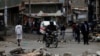 A motorcyclist drives through obstacles placed on a street by supporters of opposition leader Raila Odinga during the latest protests in Mathare, Nairobi, Kenya, August 14, 2017. 