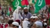 FILE - Supporters of banned sectarian group Sipah-e-Sahaba listen to their leaders at a gathering in Islamabad, Pakistan, Oct. 4, 2013. Pakistan's DAWN newspaper says that 41 of the 64 extremist organizations banned by the government operate freely online