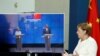 German Chancellor Angela Merkel, right, speaks as she holds a video news conference with European Council President Charles Michel, right on screen, and European Commission President Ursula von der Leyen, in Berlin, Sept. 14, 2020. 