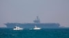 FILE - The United States' Navy USS George H.W. Bush aircraft carrier is seen docked in the Mediterranean Sea off the coast of Haifa, Israel, July 1, 2017. The U.S.-led anti-IS military coalition said Wednesday it conducted no airstrikes in Syria between May 5 and June 3.