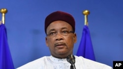 President of Niger Mahamadou Issoufou speaks with the media as he arrives for an EU-Sahel meeting at EU headquarters in Brussels on Feb. 23, 2018.