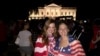 Soccer fans Laura Neff of California (left) and Kayli Westling of Wyoming celebrate the U.S. women’s national team World Cup final victory with the American Outlaws outside the White House, July 5.