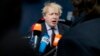 British Foreign Secretary Boris Johnson speaks with the media as he arrives for a meeting of EU foreign ministers at the Europa building in Brussels, March 19, 2018. 