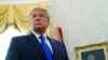 FILE - President Donald Trump listens to a reporter's question at an event in the Oval Office of the White House, in Washington, Dec. 7, 2020.