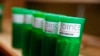 FILE - Different strains of marijuana are displayed for sale at The Clinic, a Denver-based dispensary with several outlets, in Denver, Colorado.