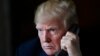 President Donald Trump talks with troops via teleconference from his Mar-a-Lago estate in Palm Beach, Fla., Nov. 22, 2018. 