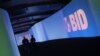 Visitors walk past a screen with the logo of Banco Interamericano de Desarrollo (BID) at the Atlapa Convention Center in Panama City March 13, 2013. Panama will be holding the annual meeting for Boards of Governors of BID, also known as the Inter-American