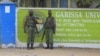 FILE - Kenya Administration policemen stand in front of Garissa University College in Garissa, April 4, 2015.