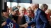 Democratic presidential candidate and former Vice President Joe Biden shakes hands as he arrives for a town hall meeting, in Ottumwa, Iowa, June 11, 2019. 