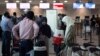 People line up to check in for a flight from Toronto Pearson International Airport to Riyadh, Saudi Arabia, in Toronto, Canada, Aug. 10, 2018. 