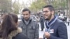 Nizarr Bourchada (R), a member of France's Union of French Muslim Democrats, on Monday visited Place de la Republique to pay tribute to the 129 people killed in last week’s Paris attacks, Paris, Nov. 16, 2015. (Photo - L. Bryant/VOA)