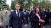 FILE - French President Emmanuel Macron and Paris Mayor Anne Hidalgo attend a ceremony to commemorate the 80th anniversary of the Liberation of Paris next to the Denfert Rocherau Square in Paris, Aug. 25, 2024.