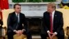 President Donald Trump greets Brazilian President Jair Bolsonaro during a news conference in the Rose Garden of the White House, March 19, 2019.