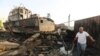FILE - Workers inspect damage at the site of an air strike on the maintenance hub at the Hodeida port, Yemen, May 27, 2018. 