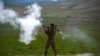 FILE - An Afghan National Army (ANA) soldier fires a rocket-propelled grenade (RPG) during a military operation in Badghis Province. The Taliban staged coordinated raids in two districts of northwestern Badghis province Sunday, killing 21 Afghan soldiers and police personnel.