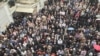Hundreds of Iranian supporters of Iran's national trade union rally outside its Workers' House building in Tehran, May 1, 2018. 