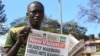 FILE - A news vendor displays newspapers in the Ugandan capital Kampala, Oct. 6, 2014. The World Health Organization is currently part of an effort working to rapidly contain an outbreak of the deadly Marburg virus disease in eastern Uganda on the border with Kenya, Oct. 20, 2017.