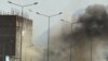 Smoke rises from the site of an attack near the Afghan parliament in Kabul April 15, 2012.