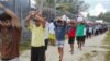 FILE - An undated image released Nov. 13, 2017, shows detainees staging a protest inside the compound at the Manus Island detention center in Papua New Guinea. (Refugee Action Coalition/Handout via Reuters)