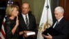 Vice President Mike Pence swears in Betsy DeVos as U.S. education secretary at the Eisenhower Executive Office Building at the White House in Washington, Feb. 7, 2017. With them is DeVos' husband, Dick DeVos.