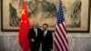 U.S. National Security Adviser Tom Donilon, left, and Chinese State Councilor Yang Jiechi, right, shake hands before their meeting at Diaoyutai State Guesthouse in Beijing, May 27, 2013.