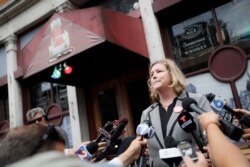 FILE - Dayton, Ohio, Mayor Nan Whaley speaks to members of the media Aug. 6, 2019, outside Ned Peppers bar in the Oregon District after a mass shooting early Sunday in Dayton.