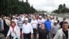 Kemal Kilicdaroglu,foreground, second left, the leader of Turkey's main opposition Republican People's Party, walks with thousands of supporters on the 20th day of his 425-kilometer (265-mile) " march for justice " in Izmit, Turkey, Tuesday, July 4, 2017.