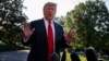 President Donald Trump talks with reporters before departing on Marine One for an Air Force Academy graduation ceremony, May 30, 2019, in Washington.