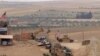 FILE - U.S. forces set up a new base in Manbij, Syria, May 8, 2018. 