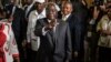 Afonso Dhlakama, a former Renamo rebel chief turned opposition leader, shows his ink-stained finger after casting his ballot at a polling station in Maputo, October 15, 2014.