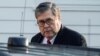 FILE - Attorney General William Barr leaves his house in McClean, Virginia, March 25, 2019.
