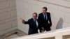 French President, Francois Hollande (l) and British Prime Minister David Cameron arrive for a press conference in Amiens, northern France, March 3, 2016.